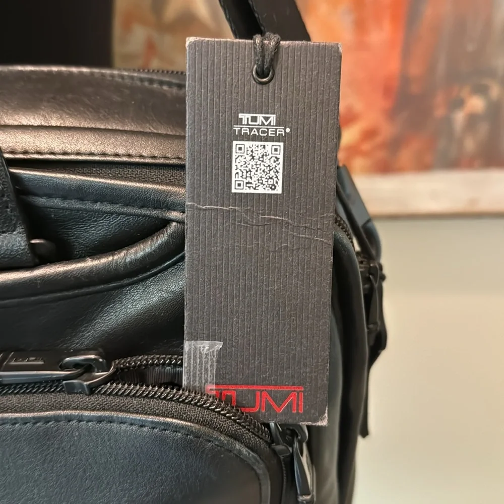 TUMi black leather computer briefcase carry-on VGC long strap multiple pockets